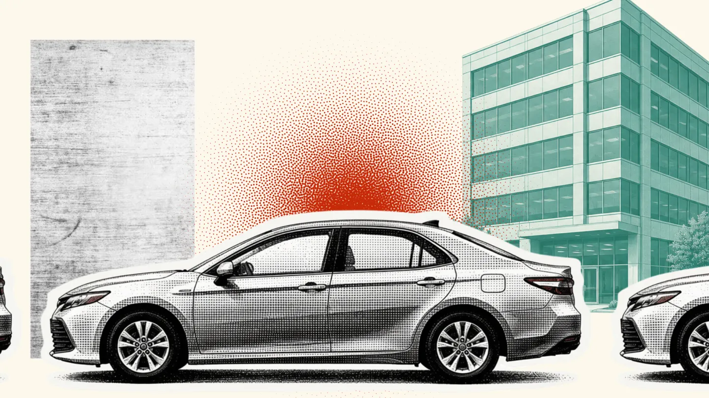 car in traffic with buildings